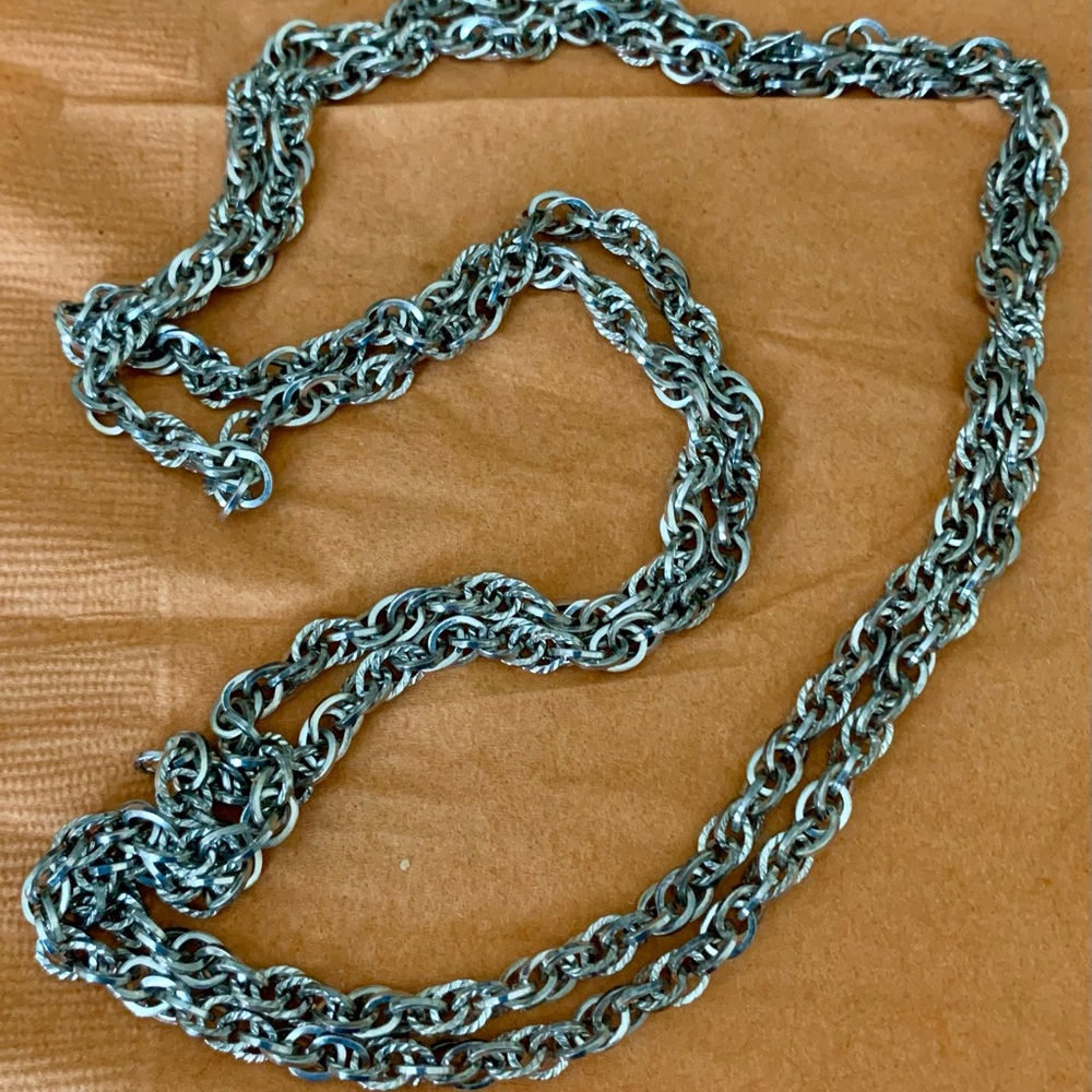 A long silver diamond cut chain